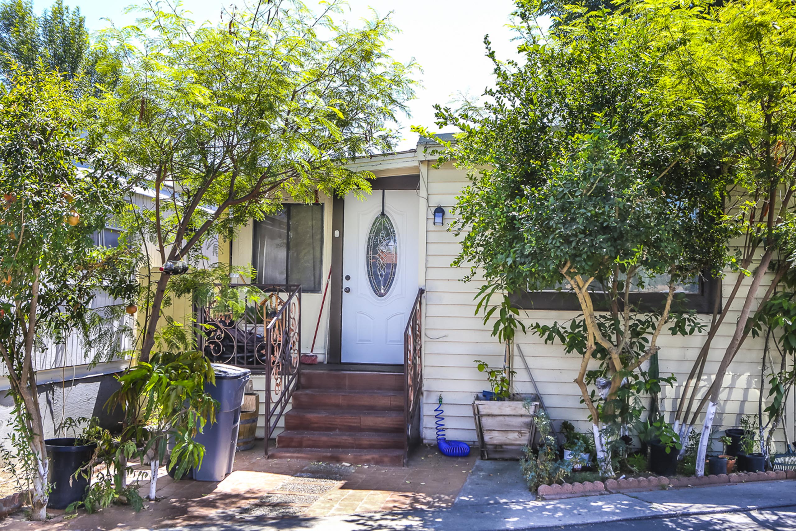 tree lined trailer home in condesa village mobile home park bellflower, california